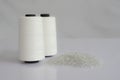Polyester chips & Raw White Polyester FDY Yarn spool Royalty Free Stock Photo