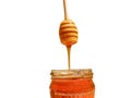 Polyflora bee honey flowing into a jar from a wooden spoon. The concept of beekeeping Royalty Free Stock Photo