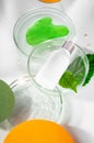 Polyglutamic acid, for deep hydration and facial skin care. Petri dishes with green leaf and water. Background with Royalty Free Stock Photo