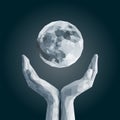 Polygonal full moon in cupped hand monochrome white