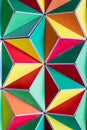 polygonal surface with colored triangles, tessellation of a three-dimensional floor with colored polygons. decoration with