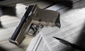 Polymer pistol on the publlic domain paperwork required by the FBI to purchase a handgun Royalty Free Stock Photo