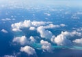 Polynesia. The atoll in ocean through clouds. Aerial view. Royalty Free Stock Photo