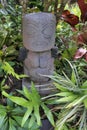 Polynesian female figurine wooden carving sculptur in a tropical