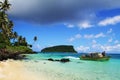 Polynesian fishermen on the boat, sandy tropical Pacific Ocean beach Samoa islands Royalty Free Stock Photo