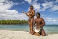 Polynesian men playing traditional instruments on Bora Bora beach - French Polynesia Royalty Free Stock Photo