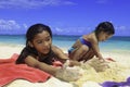 Polynesian sisters at the beach Royalty Free Stock Photo