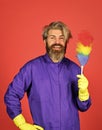 Polypropylene duster. Hipster holding cleaning tool. Cleaning home concept. Small colorful duster broom. Cleaning