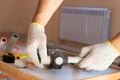 Soldering iron for polypropylene plumbing pipes. The hands of the plumber are holding the pipeline parts. Royalty Free Stock Photo