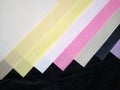 Polypropylene Spunbond Nonwoven Fabric with different colours on white background Royalty Free Stock Photo