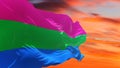 Polysexuality Pride flag waving in the wind at cloudy sky. Freedom and love concept. Pride month. activism, community and freedom