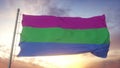 Polysexuality pride flag waving in the wind, sky and sun background. 3d rendering Royalty Free Stock Photo