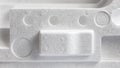 Polystyrene or styrofoam padding for product packaging. Detail of styrene foam plastic box close-up Royalty Free Stock Photo