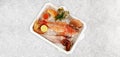 Polystyrene Transportation Box with Fish and Sea Food on Ice. Sea Weed, Caviar, Mussels, Oysters and Scallop on white Background