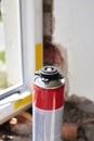 Polyurethane foam for mounting a new plastic window, repair work Royalty Free Stock Photo
