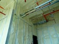 Polyurethane insulating foam that has been sprayed and covered the concrete slabs and walls surface.