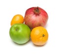 Pomegranade, apple, tangerine on white Royalty Free Stock Photo