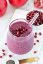 Pomegranate and chia seed smoothie in a glass with fresh fruit on white kitchen table Royalty Free Stock Photo