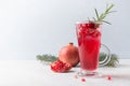 Pomegranate Christmas cocktail with rosemary, champagne, club soda. Royalty Free Stock Photo