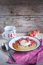 Pomegranate and cornmeal polenta breakfast with greek yogurt