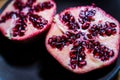 Pomegranate cut open with a unique pattern of seeds Royalty Free Stock Photo