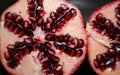 Pomegranate cut open with a unique pattern of seeds Royalty Free Stock Photo