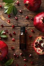 pomegranate essential oil in a bottle. selective focus.