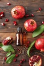 pomegranate essential oil in a bottle. selective focus.