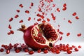 Pomegranate exploding with vibrant seeds captured in mid-air during a dynamic culinary demonstration Royalty Free Stock Photo