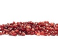 Ripe pomegranate berries on a white background