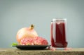 Fresh pomegranate fruit, high Vitamin C, Red drink, on dark background Royalty Free Stock Photo