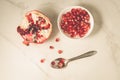 pomegranate fruit, the purified pomegranate seeds in a bowl/pomegranate fruit, the purified pomegranate seeds in a bowl on a white