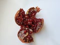 Pomegranate Fruit Sliced into Four Section isolated on white Background Royalty Free Stock Photo