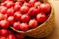 Pomegranate fruits in basket. Heap of fresh pomegranates