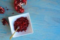 Pomegranate fruits inside a white bowl