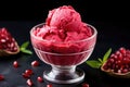 pomegranate gelato in a glass bowl with pomegranate seeds