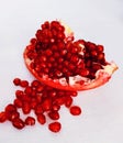 Pomegranate grains (Punica granatum) fruit cut sliced with grains red ripe anaar rodie nar melograno anor grenadefruit Royalty Free Stock Photo