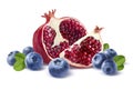 Pomegranate half, quarter and blueberries isolated on white back