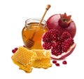 Pomegranate, honey jar and honeycomb isolated on white background