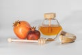 Pomegranate, honey and shofar isolated on white background. Image of Rosh HaShanah jewish New Year holiday.