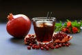 Pomegranate juice, fruit, seeds, branches. Royalty Free Stock Photo