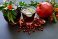 Pomegranate juice, fruit, seeds, branches. Royalty Free Stock Photo