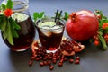 Pomegranate juice, fruit, seeds, branches. Royalty Free Stock Photo