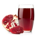 Pomegranate juice in a glass and ripe pomegranate Royalty Free Stock Photo