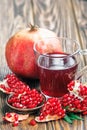 Pomegranate juice with ripe fresh punica granatum fruits Royalty Free Stock Photo