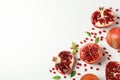 Pomegranate, juice and seeds on background, top view