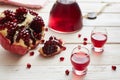 Pomegranate moonshine or alcohol tincture, apperol, in piles and decanter Royalty Free Stock Photo