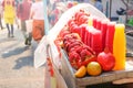 Pomegranate and orange with squeezed juice packed in bottles on stall