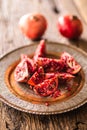 Pomegranate. Pieces of frest pomegranate on plate Royalty Free Stock Photo