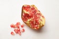 Pomegranate, (Punica granatum) with green leaf cut in half isolated on white backdrop.concept healthy fruit